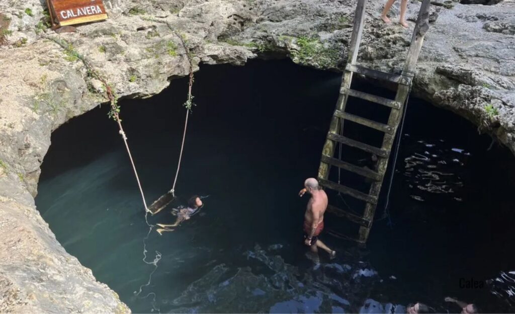 Aerial view of Cenote Calavera, one of the most famous cenotes in Tulum



